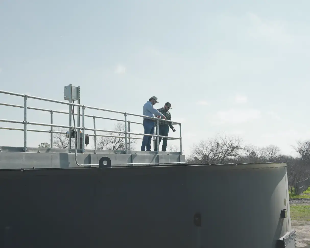 Two men on a water silo